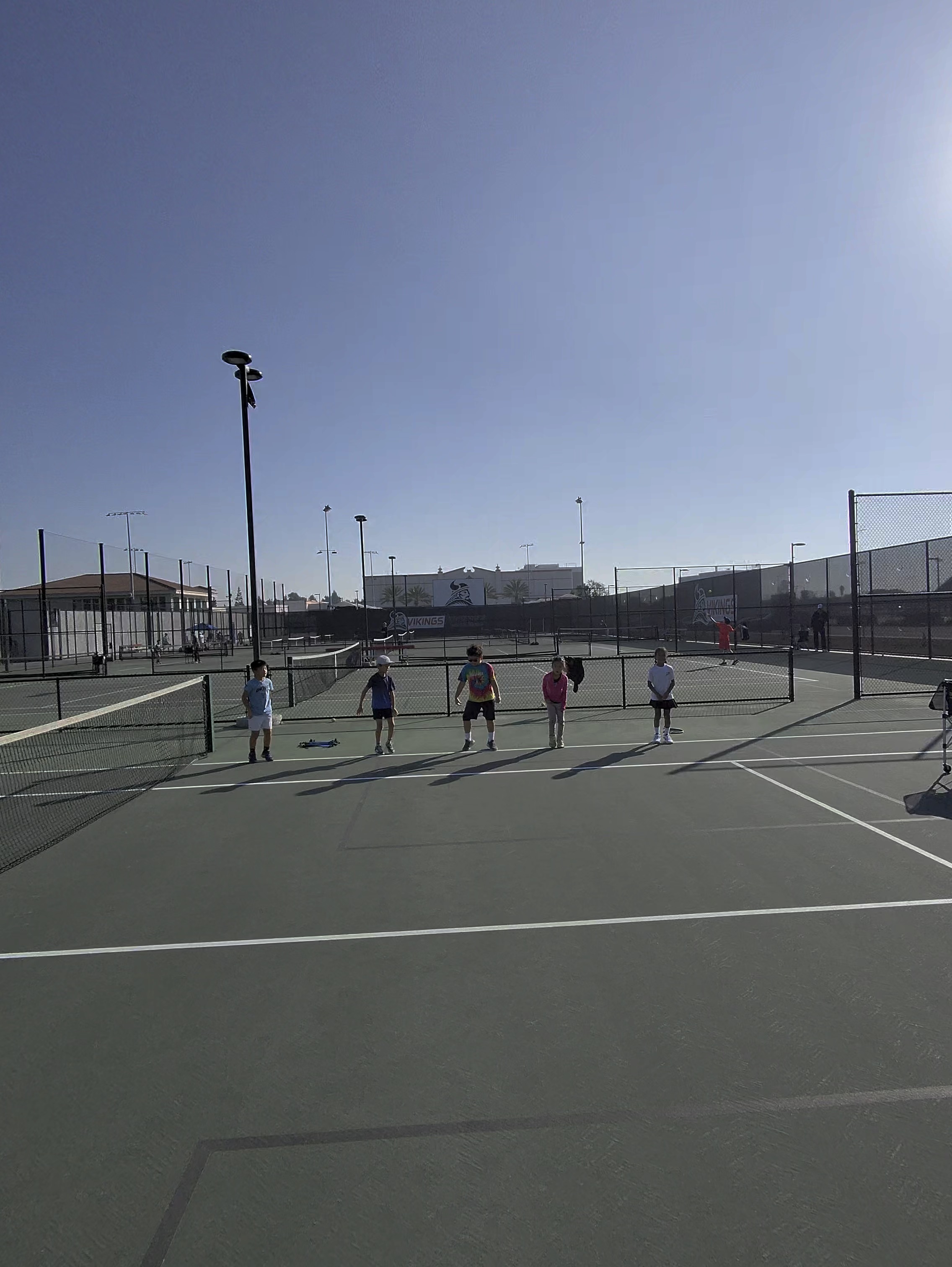 Junior players on court