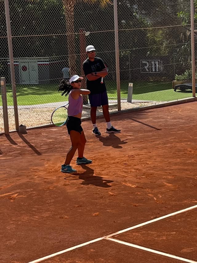 Young player forehand on clay court