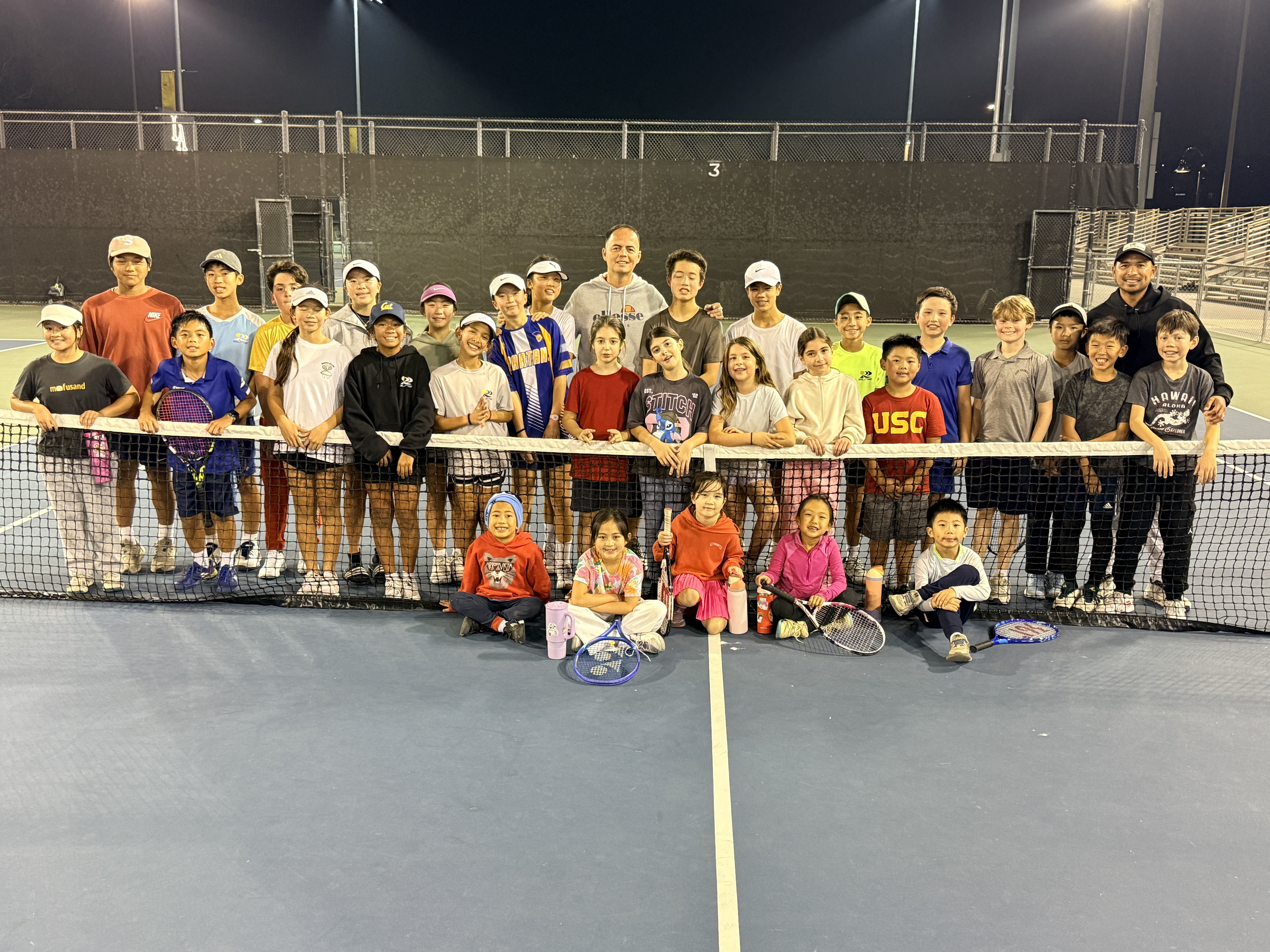 A young player receiving a trophy